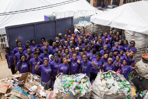 WeCyclers founders and employees pose for a photograph at their headquarters after being announced winner of the King Baudouin Foundation African Development Prize 2018-19 at the company’s headquarters on Wednesday 20th March 2019 in Lagos Island, Lagos, Nigeria.